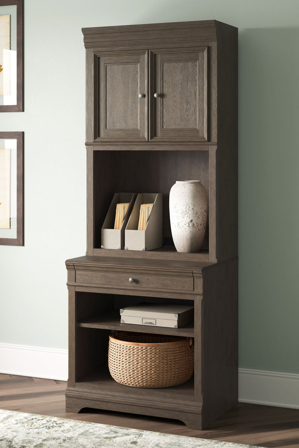 Make a style statement with this home office bookcase. Its traditional design is updated with an on-trend weathered gray finish and wire-brushed texture. A hutch with LED underlighting shines a light on those elusive reading glasses and other desktop item