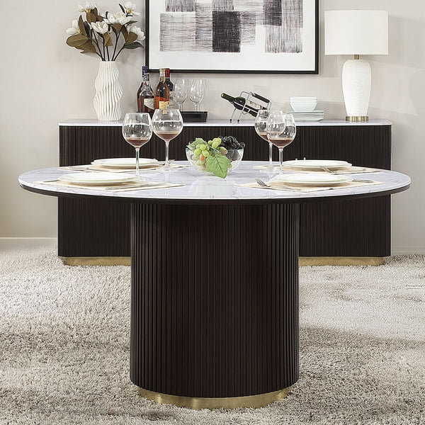 The Clayten collection features a round dining table with a fixed marble top, supported by a single pedestal base adorned with metal trim. Accompanied by upholstered chairs and a server with sleek metal legs, this set combines modern elegance with timeles