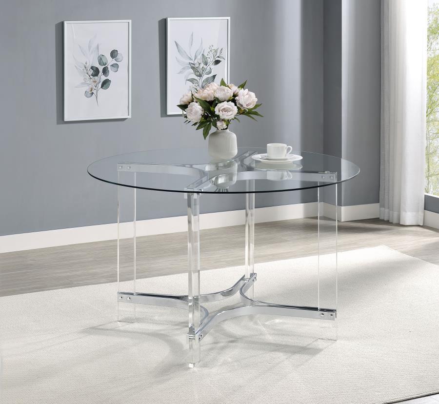 Center your dining experience on a chic, modern round dining table with sculptural appeal. It boasts four straight clear acrylic legs with four-point star bases that create incredible stability. The gleaming chrome finish stands out, adding artistry to yo