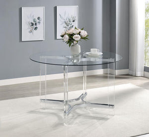  modern round dining table with sculptural appeal. It boasts four straight clear acrylic legs with four-point star bases that create incredible stability. The gleaming chrome finish stands out