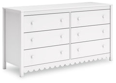Thanks to its playful scalloped design, this dresser is the perfect fit for cottage or coastal farmhouse interiors. The matte white finish serves as the perfect backdrop to showcase your personal taste and creativity. And its spacious drawers let you say 