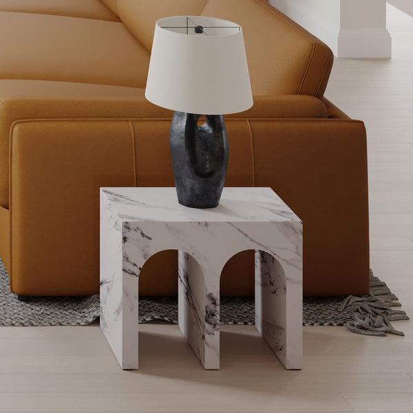 Introducing the Fritzy collection, a masterpiece of modern elegance in a striking white finish. These pieces, characterized by clean lines and a chic aesthetic, elevate any living space with their sophisticated presence. The coffee table and the uniquely 