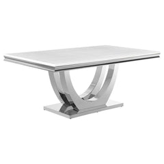 Host family and friends around this sleek, modern glam dining table for an elevated dining experience. Designed with an open demilune pedestal base in a lustrous polished chrome finish, this magnificent, rectangular dining table lends a luxurious look and