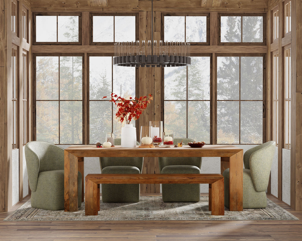 Crafted from solid mango, this table boasts a unique aesthetic with natural variations of color, wood grain, and knots. The geometric mitered edge creates a seamless transition between the table top, apron, and angled legs, and is generously proportioned 