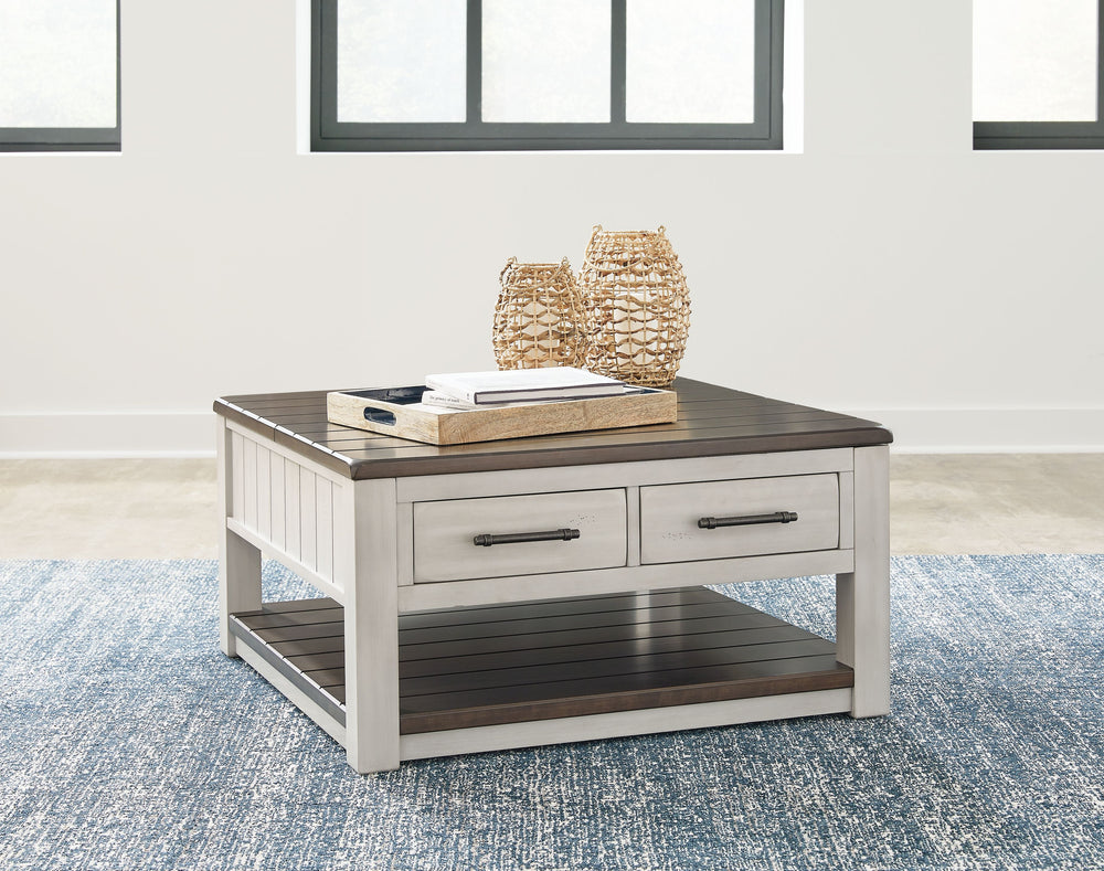 Make a farmhouse-inspired statement with this coffee table. Beautifully crafted to stand the test of time, the planked look and clean two-tone finish lend a relaxing vintage feel. A clever lift-top section and spacious storage drawers double up on form an