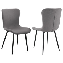 This dining chair combines sleek modern design with practical comfort. Upholstered in a grey linen-like fabric, the seat and backrest are crafted for easy care and long-lasting use. The contoured design offers ergonomic support, while the foam-padded seat