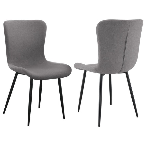This dining chair combines sleek modern design with practical comfort. Upholstered in a grey linen-like fabric, the seat and backrest are crafted for easy care and long-lasting use. The contoured design offers ergonomic support, while the foam-padded seat