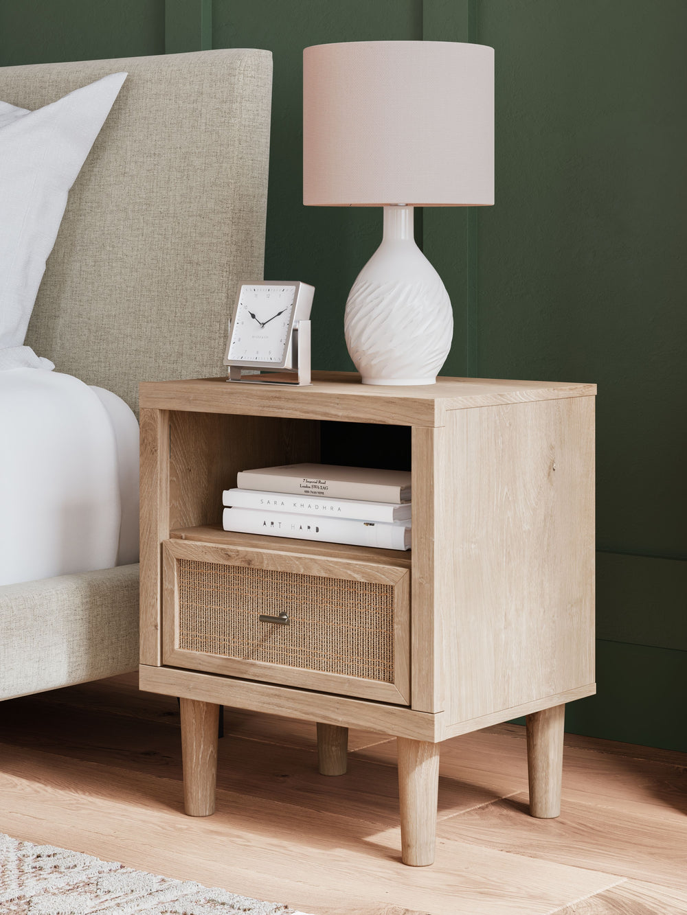 Clean-lined and contemporaryâ€”but far from starkâ€”this nightstand is a fresh style awakening. Pairing a light finish with replicated oak grain and textured beige details that replicate the look of cane, its mixed materials bring a naturally versatile vi