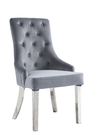 Contemporary flair graces classic silhouettes to create a timeless design that will blend with any home style. This Parson style side chair has an upholstered height back adorned by a sparkling nail-head border and a silver pull-ring, with button-tufted d