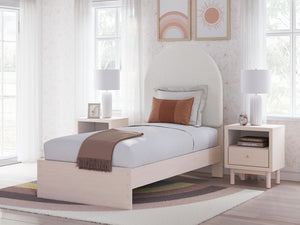 Pretty in pink. This twin upholstered panel bed keeps the spirit of your homeâ€™s modern aesthetic while suiting all your young oneâ€™s needs. Its cozy-cute upholstery and subtle blush finish bring a playful, charming vibe to bedtime. Made for her and sty