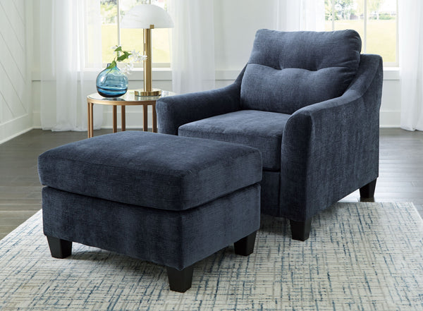 Urban contemporary meets mid century (with a pop of trend-right color) in this seating package. Supremely soft upholstery, teeming with luster and movement, finesses the set with just the right touch. Gently flared arms and tufted back cushions let you ba