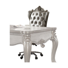 The Versailles executive arm chair classic style will blend masterfully in your home. Carefully constructed from faux leather, and selected veneers in rich antique platinum finish. Highly decorative details, button tufted backrest with Nailhead trim, and 