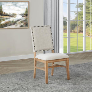  it features individually hand-driven black nailhead trim for artisanal detail. Crafted with a solid hardwood frame and legs in a natural bro