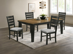 This dining group effortlessly combines farmhouse warmth with modern sophistication, creating a captivating focal point for any dining space. The table features a rich, two-tone design with a beautifully finished wood top and contrasting dark legs, delive