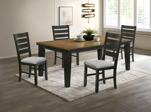 This dining group effortlessly combines farmhouse warmth with modern sophistication, creating a captivating focal point for any dining space. The table features a rich, two-tone design with a beautifully finished wood top and contrasting dark legs, delive