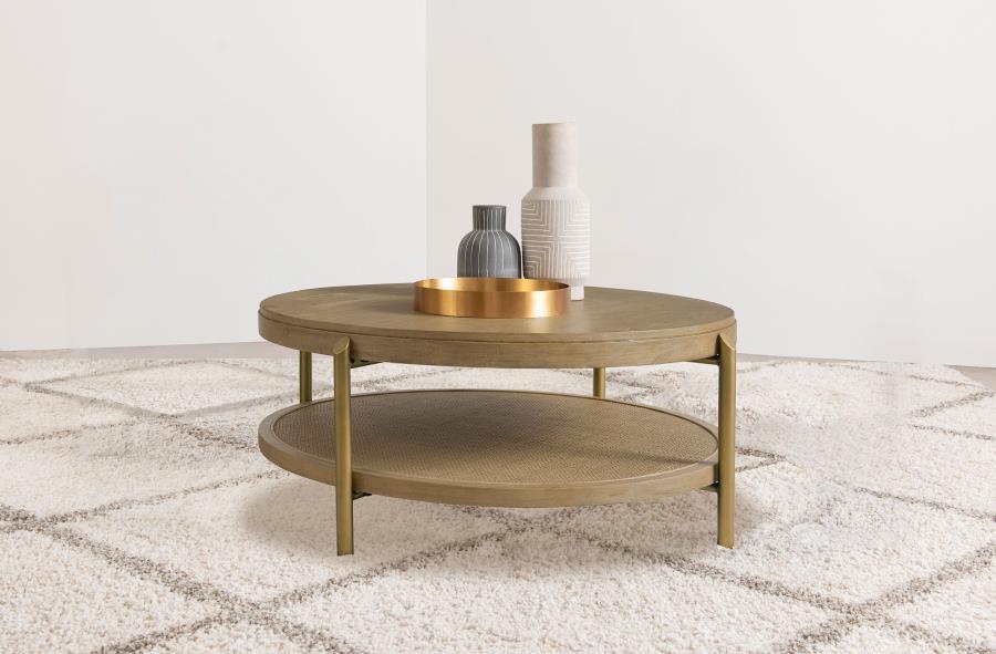 This round coffee table combines modern design with rustic charm, perfect for todayâ€™s living spaces. Crafted with Asian hardwood, engineered wood, and ash veneer, its smooth finish highlights the natural wood grain for an organic appeal. The lower shelf