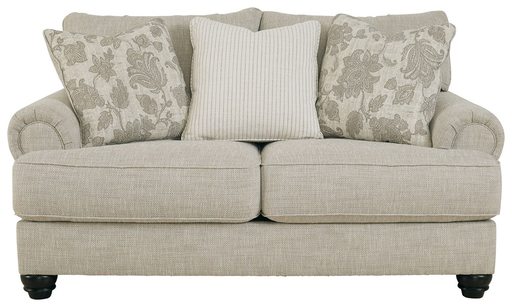 This loveseat has an alluring look that-'s guaranteed to turn heads. Richly textured fabric in a light, easygoing hue is enhanced by even lighter flax peeking through. Distinctive roll arms add a dab of debonair, while indulgently plush cushions cradle yo