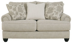 This loveseat has an alluring look that-'s guaranteed to turn heads. Richly textured fabric in a light, easygoing hue is enhanced by even lighter flax peeking through. Distinctive roll arms add a dab of debonair, while indulgently plush cushions cradle yo
