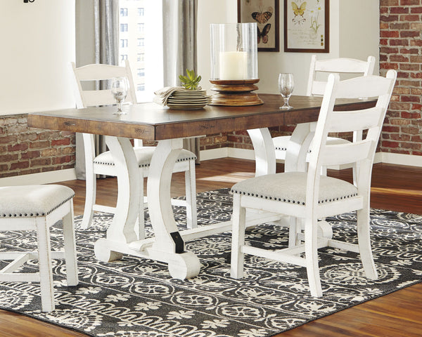  this dining table serves up the best in rustic farmhouse living. Its two-tone distressed finish pairs a brown tabletop with a vintage white base for a double helping of charm. This extension dining table features an 