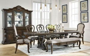 Opulent Traditional styling. Inspired by the grandeur and grace of Old World traditional style, this dining room collection is nothing short of stunning. A choice blend of materials is accented by detailed ornamental appliques large scaled decorative pila