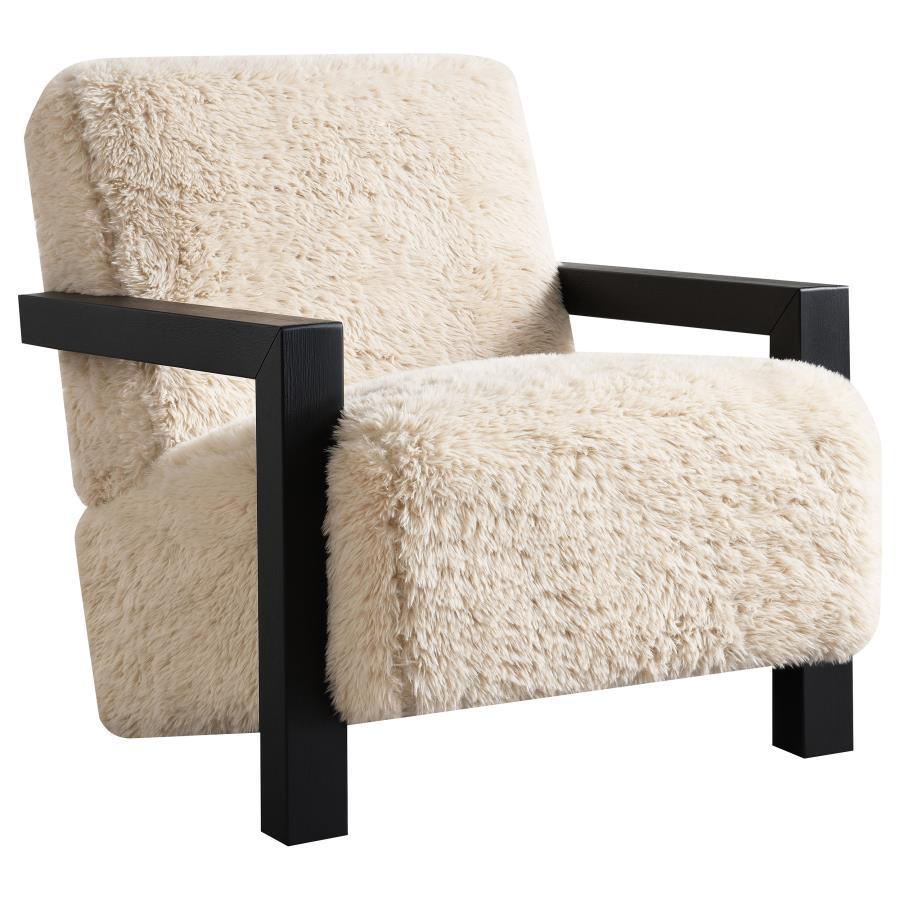 This accent chair envelops you in plush comfort, thanks to foam-padded back and seat cushions upholstered in latte faux fur. A solid hardwood frame ensures reliable support, while the luxurious texture enhances any living area or reading nook. As a statem