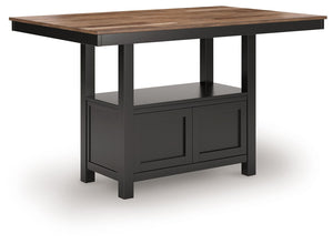 This counter height dining table dresses up your favorite farmhouse motifs with modern flair. A butcherblock-style top provides ruggedly chic contrast to the sleek black base. Short on storage space? The pedestalâ€™s built-in cabinet, with doors on each s