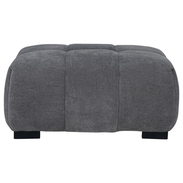  neutral upholstery and subtle grid tufting bring depth and texture to your dÃ©cor