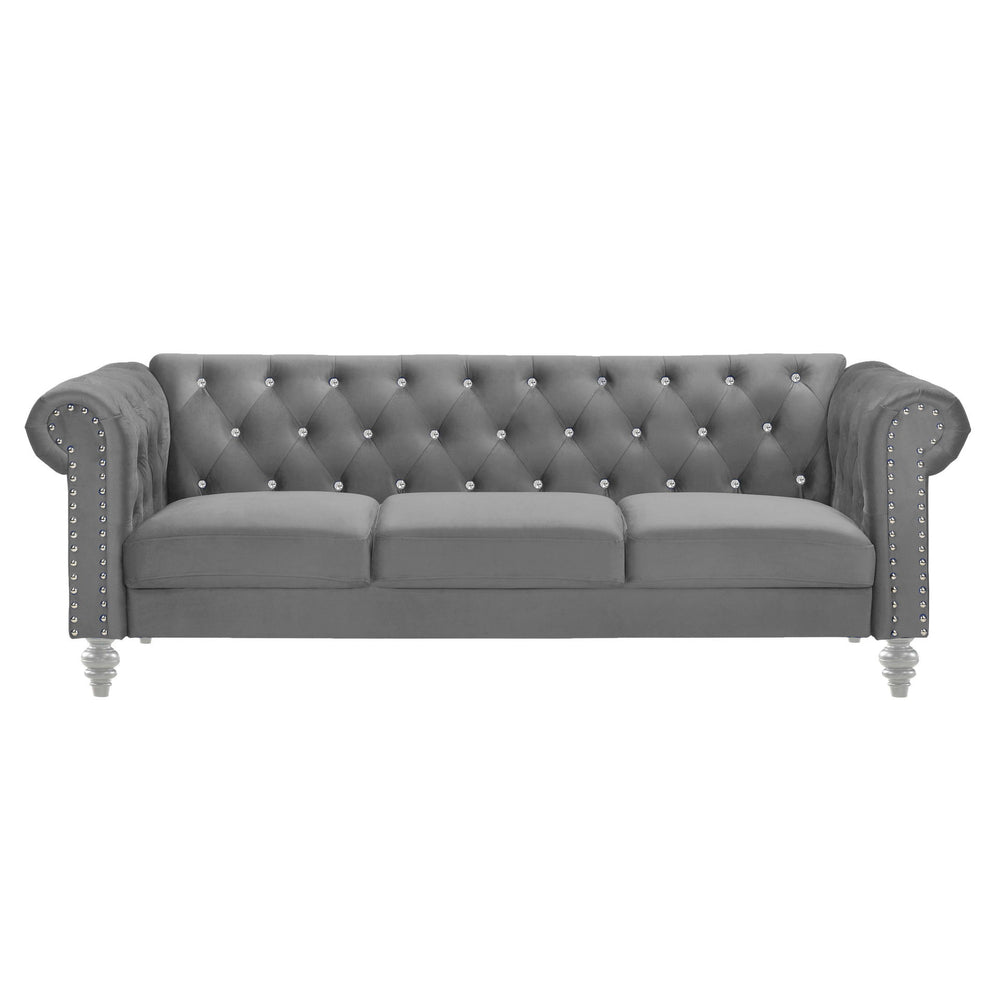 The New Classic Emma Chesterfield Velvet 3 Seat Sofa is a blend of soft elegance and sophisticated design. Crafted from 100% polyester velvet fabric, it offers cozy and indulgent seating for three. The glam tailoring features tufted backs and arms adorned