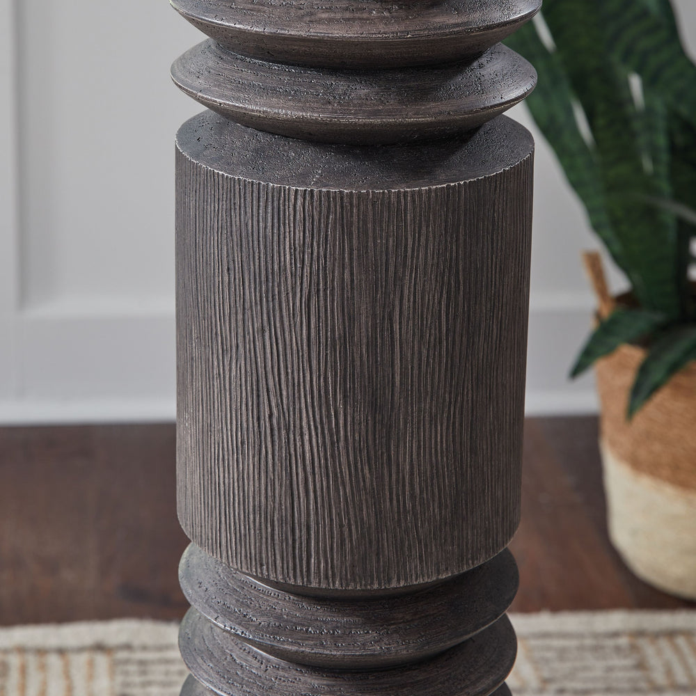 A distressed black finish and carved details make this contemporary floor lamp hard to miss. Its distinctive profile is fresh and forward thinking, illuminating your home with just the right amount of sophistication.<br><br><b>Additional Dimensions</b><br