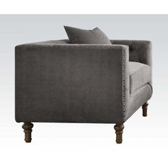 Sidonia collection is a distinct piece that intersects the mid-century and today. Expertly handcrafted in selected velvet fabric, features tufted back cushion, high shelter armrest with nailhead trim and wooden turned leg. Complemented by overstuffed seat