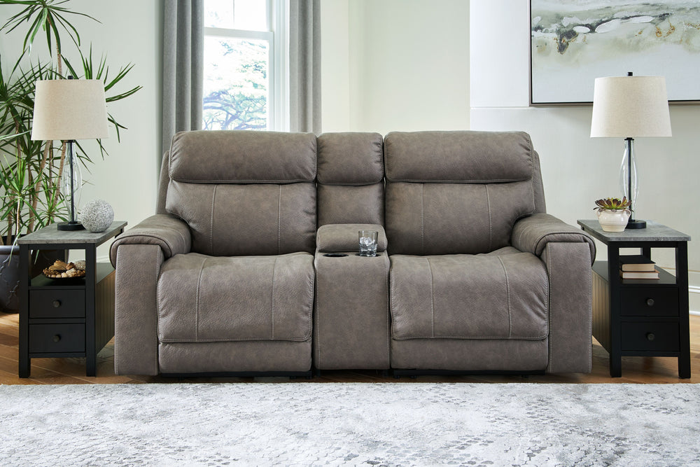Destination: chic comfort. This power reclining loveseat with console launches your living room into superior form with stellar attention to detail. Exemplifying attainable luxury, its handsome hue has an air of sophistication youâ€™ll long to lounge in. 