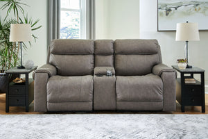 Destination: chic comfort. This power reclining loveseat with console launches your living room into superior form with stellar attention to detail. Exemplifying attainable luxury, its handsome hue has an air of sophistication youâ€™ll long to lounge in. 