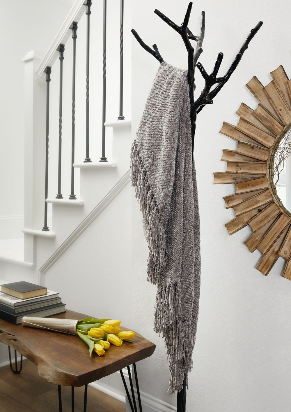 A lovely layer to cozy up with, this gray throw blanket also makes a stylish statement. Whether draped over the arm of a sofa or folded at the foot of a bed, the woven texture and knotted fringe give it a homespun look that-'s relaxed and inviting.<br/><b