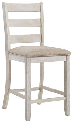 This upholstered bar stool invites you to raise the bar on small space living. An inspired choice for coastal chic or modern farmhouse settings, this comfortably cushioned bar stool with classic ladderback styling sports a grayish white finish with rub th