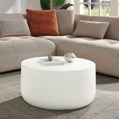 The Dustan round coffee table boasts a sleek, modern design with its fixed table top and faux concrete finish. Ideal for contemporary spaces, it offers a minimalist aesthetic that effortlessly enhances any living area. This stylish piece is perfect for th