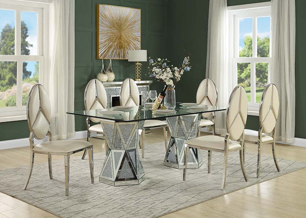 Shine and polish your dining room with pure glamour with the Noralie dining table. Tempered glass and mirrored panels create a sophisticated elegance while the faux diamonds add the perfect finishing touch to this luxurious dining set. Rest upon tufted ch