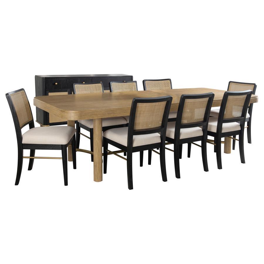 This dining set blends modern craftsmanship with natural textures for a refined yet inviting feel. The dining table features a trestle base with an antique brass-finished metal stretcher bar, adding stability and contrast. Rounded corners soften the recta