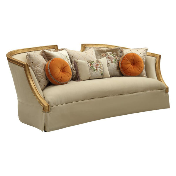 The Daesha sofa is a sophisticated traditional design, with its soft curve upholstered tight back wrapping around with a half ellipse cut out at the center top. This inviting surround appeal is accented by loose pillows upon coil seat cushions to allow fo