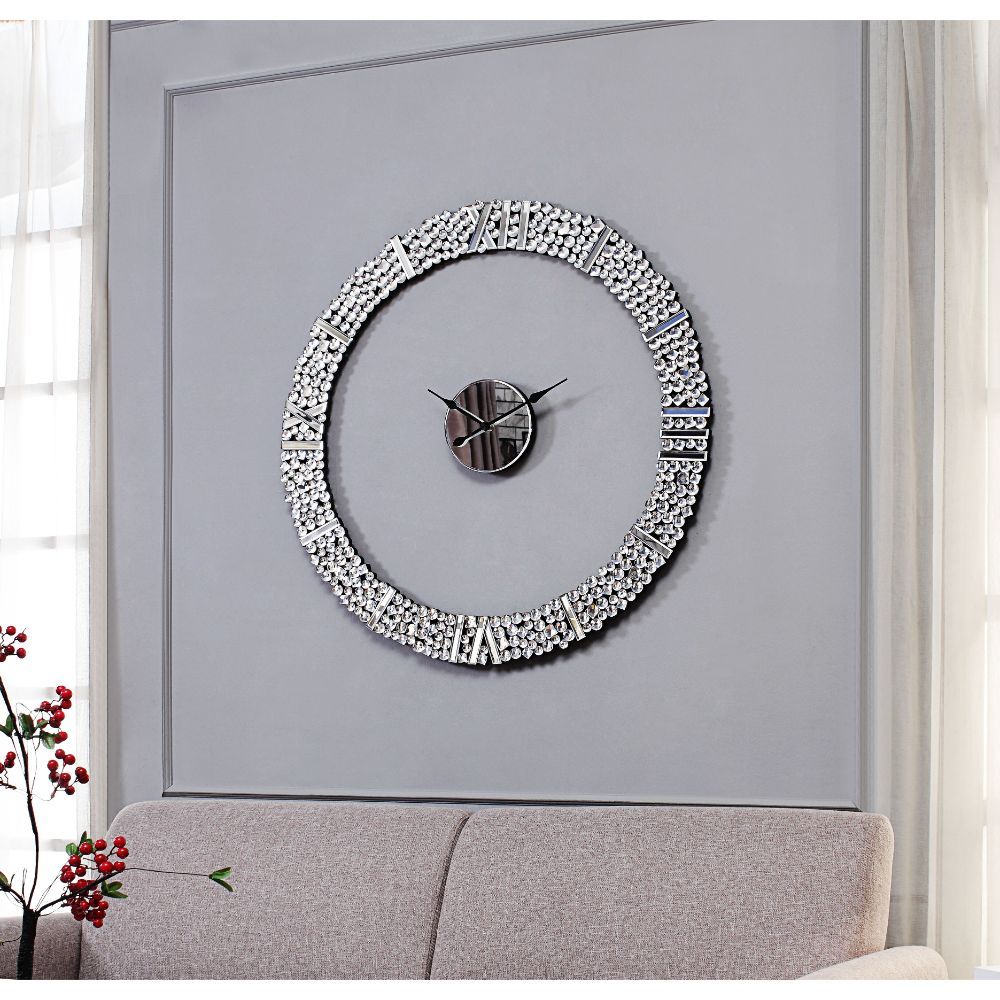 The march of time is predictable, but that doesn-'t mean the appearance of your clock has to be! This design is sure to work as a focal point in any ensemble with features like a striking round silhouette, and mirrored panels with faux gems. The Kachina w