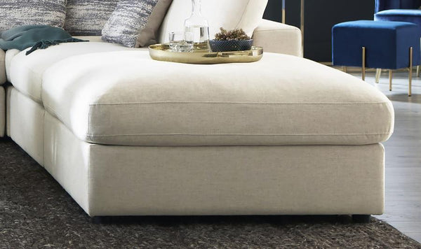  designed to blend seamlessly with modular setups or stand out on its own. Wrapped in a beige linen-blend fabric