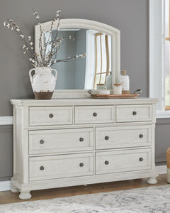 Elegant, timeless furnishings take your bedroom to the next level. Nothing does that better than this dresser with mirror. The antiqued white finish with a wonderful grain texture radiates sophistication, while the dark bronze-tone hardware adds an ornate