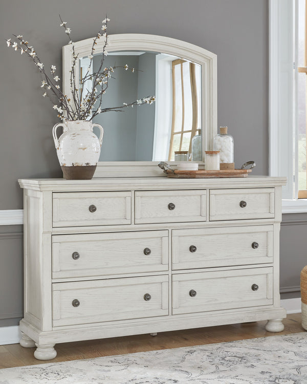  timeless furnishings take your bedroom to the next level. Nothing does that better than this panel bedroom group. The antiqued white finish with a wonderful grain texture oozes sophistication