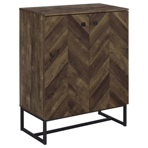 This two-door cabinet offers practical storage in a compact form, featuring a rustic oak finish and distinctive herringbone-patterned door fronts. Constructed from engineered wood with a scratch-resistant and eco-friendly laminate veneer, it includes mult