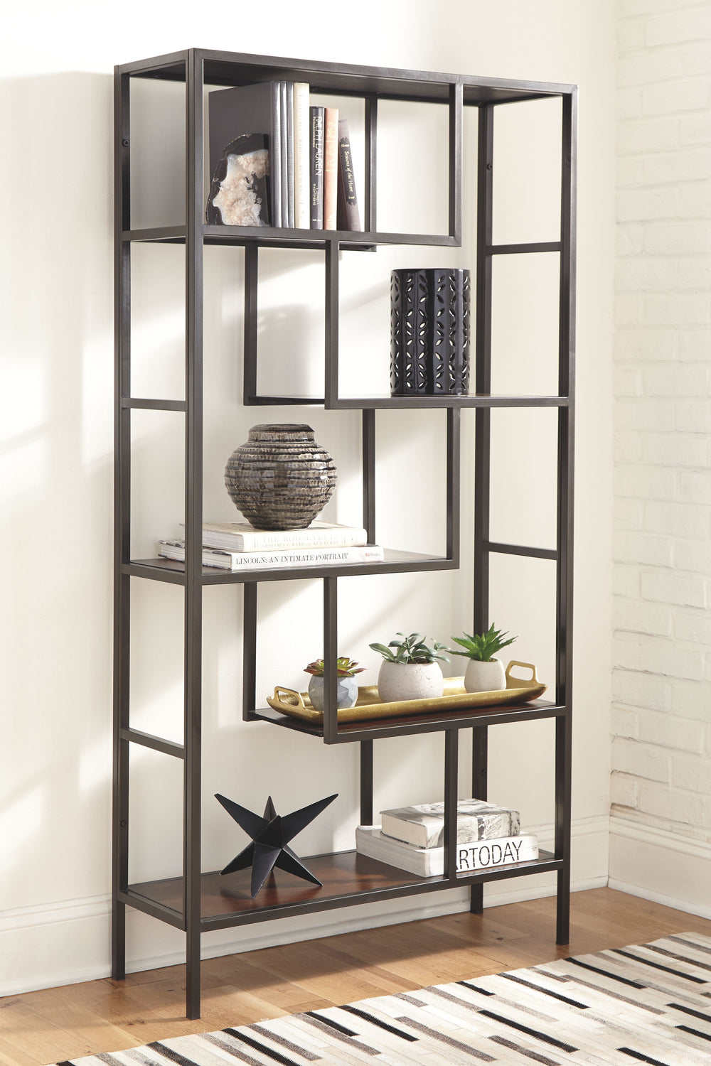 This bookcase is for the geometry lover. Five fixed shelves at various angles create gorgeous negative space in your room. Itâ€™s sleek and contemporary with quality construction. Youâ€™re going to love propping up your books in style.<br><br><b>Additiona