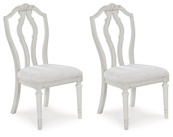 Transform your home into a haven of timeless elegance with this dining chair. Its traditional silhouette, adorned in a classic antiqued white finish, is paired with plush cushioning covered in light pearl gray upholstery. Whether you-'re settling in at me
