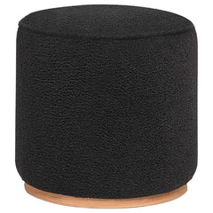 Add a touch of playful luxury to your living space with this round upholstered ottoman, swathed in sumptuous faux sheepskin that invites you to touch. Resting on a metal base that-'s been expertly finished to emulate the warm, natural allure of wood grain
