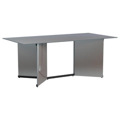 Make a statement in your glam dining room with a contemporary mirrored dining table. Its angular structure and rectangular tabletop are a dynamic collaboration, delivering dimension and depth in a refined space. Black trim complements V-shaped pedestals, 