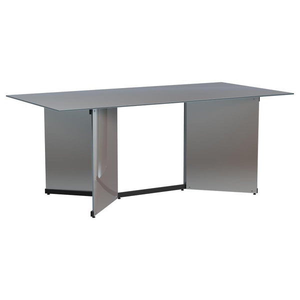 Make a statement in your glam dining room with a contemporary mirrored dining table. Its angular structure and rectangular tabletop are a dynamic collaboration, delivering dimension and depth in a refined space. Black trim complements V-shaped pedestals, 