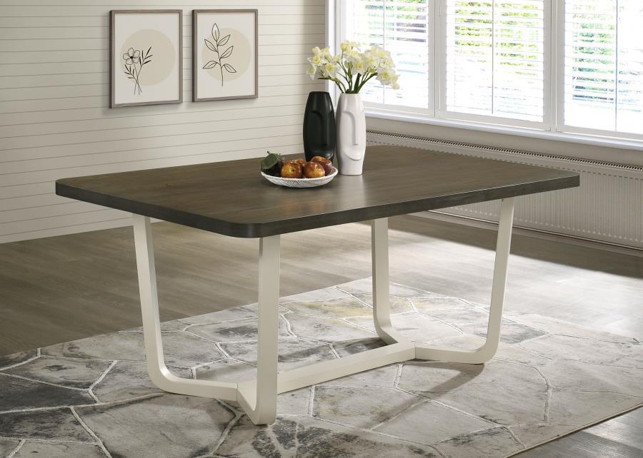 Refresh your dining room with this eye-catching modern dining table. The table features a rectangular top with rich wood grain details and smooth, rounded corners that add a sleek, welcoming touch. Supported by a bold, angular white base, the two-tone fin