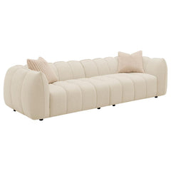 Cuddle up in stylish comfort with this modern extra-long sofa, a perfect interior focal point with its fun bubble-like design. The sofa shows off boucle upholstery in a sand pebble hue, adding an inviting warmth to your dÃ©cor. It-'s incredibly comfortabl
